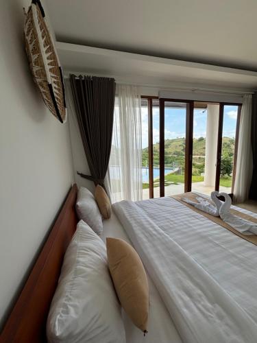 Postel nebo postele na pokoji v ubytování Villa Ayu Lombok