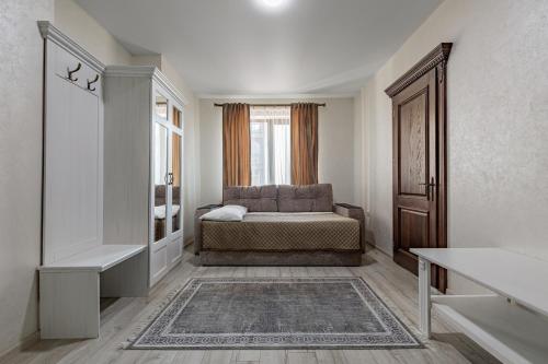 a bedroom with a bed and a window at Premium hotel & SPA in Bukovel