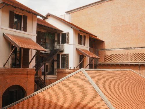 a view of a building with a red roof at Boxsoon Nimman 2 # 4beds 3baths in Chiang Mai