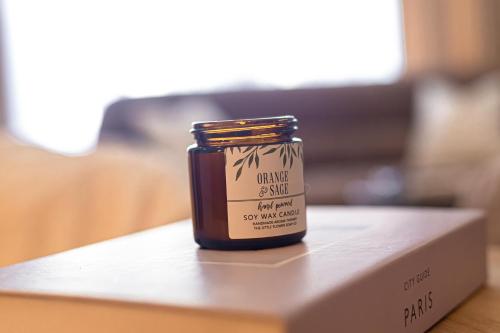 a jar of jam sitting on top of a box at POLO HEIGHTS-Sky Suites in Accra
