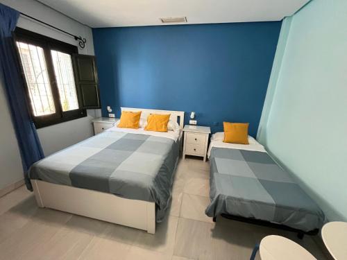 Ένα ή περισσότερα κρεβάτια σε δωμάτιο στο Hostal Baobab