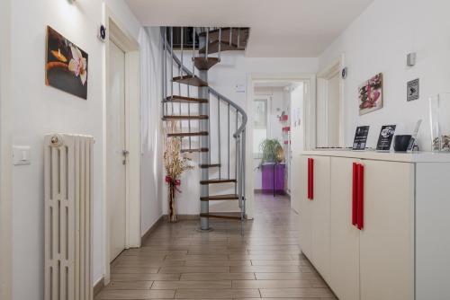 a hallway with a spiral staircase in a house at Florence Comfort B&B in Florence