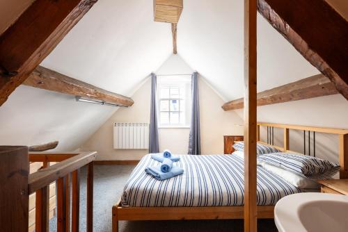 En eller flere senge i et værelse på Starfish Cottage