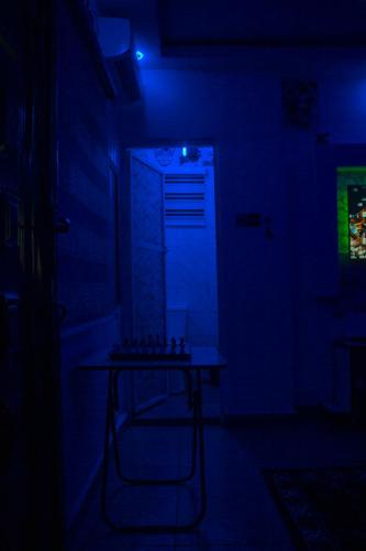 a room with a table in a dark room at Elite comfort in Enugu