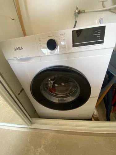 a white washing machine in a room at T2 Calvi vue mer in Calvi