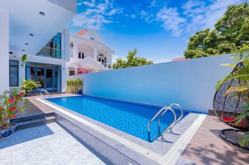 a swimming pool in the backyard of a house at Blue Sea Villa Vung Tau 3 in Vung Tau