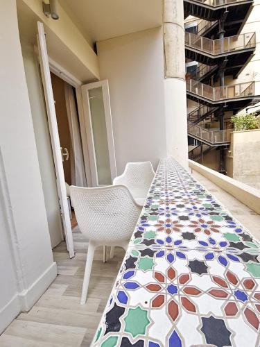 a room with a table with a patterned floor at Ambiance Downtown Cairo Hotel in Cairo
