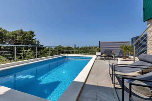 a swimming pool on the roof of a building at Villa la Perla in Baška Voda