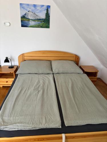 a large bed in a room with at Bodza Vendégház in Balatonfüred