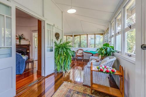 a living room with a couch and a table at Tarran in Mount Tamborine
