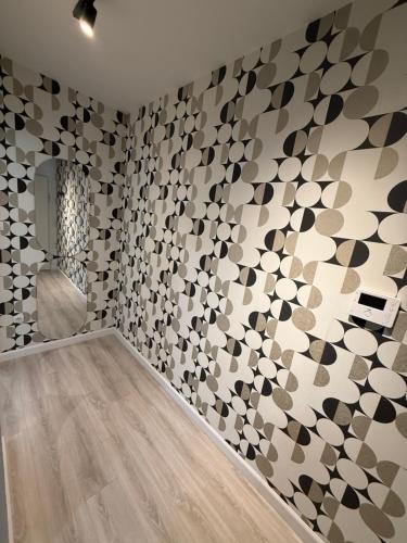 a room with a wall covered in mosaic tiles at Andjusic 1 in Trebinje