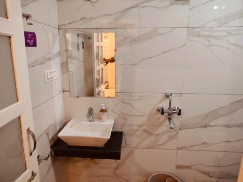 a bathroom with a sink and a mirror at The Rajshahi Vilas in Udaipur