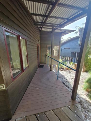 a porch of a house with awning on it at Villa Cooloola Calm - C709, Kingfisher Bay Resort in Kingfisher Bay