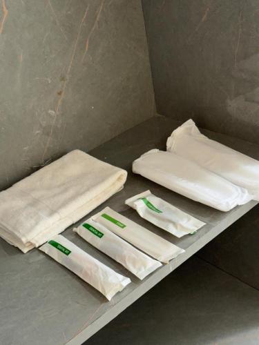 a counter with white towels on a table at Hotel Neo in Jaipur