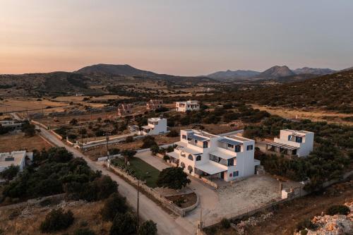 an aerial view of a white house in the desert at Aurea Blu Studio 06, sun, beach, sea, relaxation in Aliko Beach