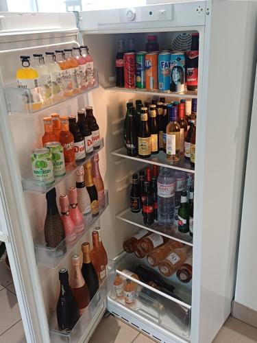 an open refrigerator filled with lots of drinks at Rêveries in Roeselare