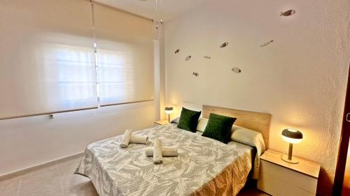 Postel nebo postele na pokoji v ubytování MARENYS 6 Playa de Miramar - Alquiler Familias