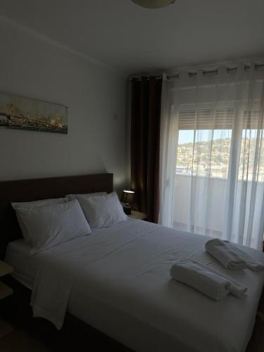 Llit o llits en una habitació de Bliss Apartment