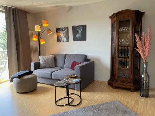 a living room with a couch and a table at Ferienwohnung Villa Grützner in Freital
