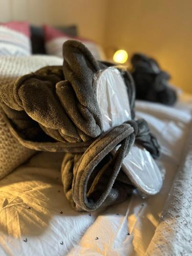 a towel sitting on top of a bed at Lofoten Retreat Apartment in Leknes