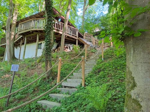 a staircase leading up to a house in the woods at Ferienhaus Gädda in Vöhl