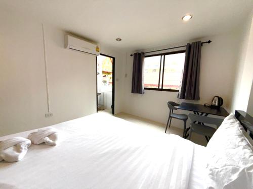 Ένα ή περισσότερα κρεβάτια σε δωμάτιο στο Patong Canal Villa 209