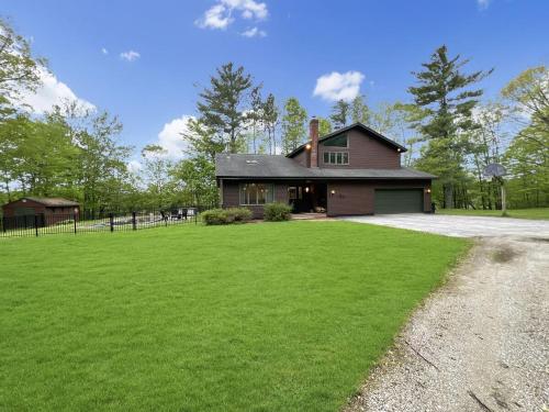 a house with a large lawn in front of it at Sugar Hollow home in Chittenden