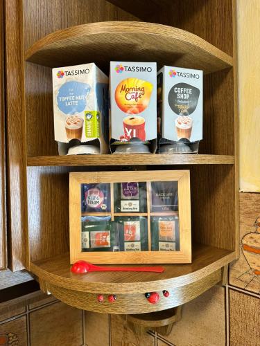 a wooden shelf with some food items on it at Ferienwohnung "FeWo am Bach" - Pegnitz in Pegnitz