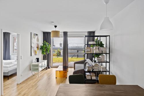 Ένα ή περισσότερα κρεβάτια σε δωμάτιο στο HIRSCH Apartments