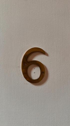a wooden letter s on a white ceiling at Ivy Ayvalık Butik Otel in Ayvalık