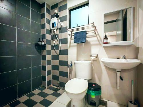 a bathroom with a toilet and a sink at Ipoh Manhattan Waterpark 3BR Suite by City Home Empire MHB509 in Ipoh