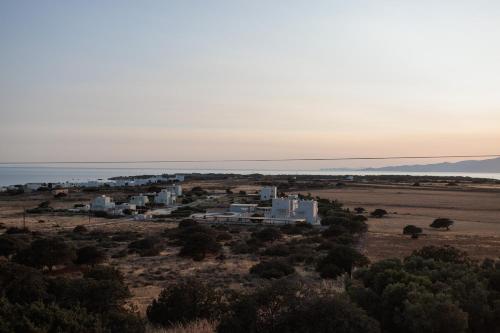 an aerial view of a white building in a field at Aurea Blu Studio 10 Dreaming, beach, tranquility, sea in Aliko Beach