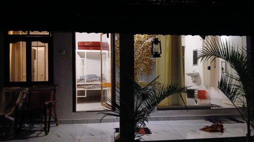 a room with a mirror and a potted plant at canan lake home in Parattipalli