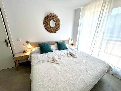Ένα ή περισσότερα κρεβάτια σε δωμάτιο στο Complejo de apartamentos, áticos y Dúplex vacacionales Empul Caños de Meca