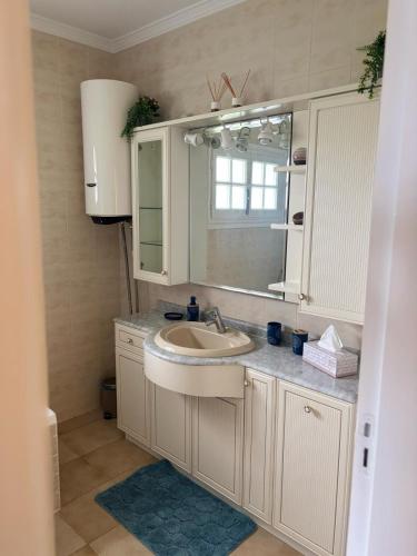 a bathroom with a sink and a mirror at Amaca in Mijas Costa