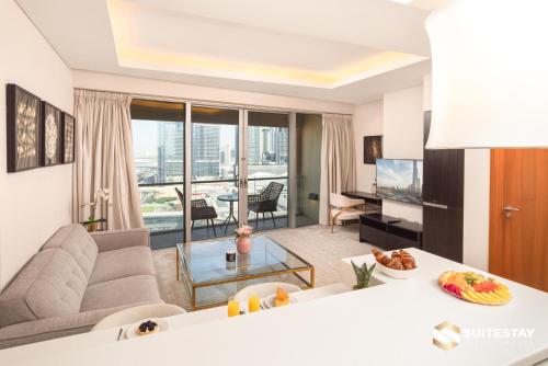 a living room with a couch and a table at Fashion Avenue Dubai Mall in Dubai