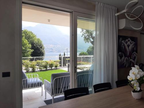 a dining room with a view of the ocean at Villa Orchidea in Onno