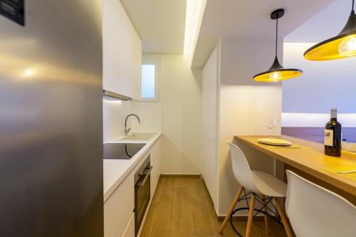 a small kitchen with a counter and a sink at Anna's Lovely Corfu Studio in Corfu