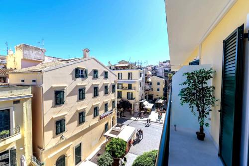 a view of a city street from an apartment balcony at Anna's Lovely Corfu Studio in Corfu