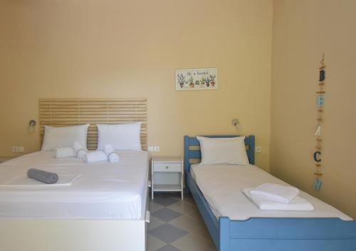 Una cama o camas en una habitación de Hotel Argilos