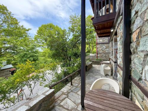 a bathroom with a toilet on the side of a building at Pliades Traditional Guesthouse in Palaios Panteleimon