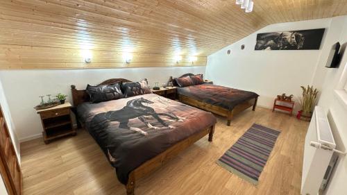 Postel nebo postele na pokoji v ubytování Casa Taraneasca "OM BUN"