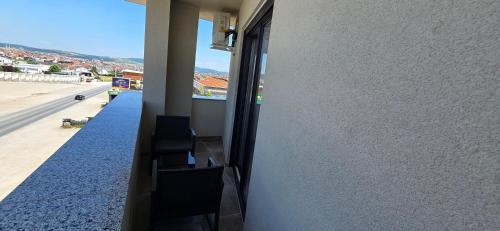 a balcony of a building with a view of a street at Hotel Pojata in Gjilan
