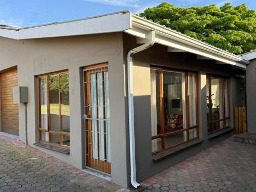 a building with windows on the side of it at 82 on 21st in Mossel Bay