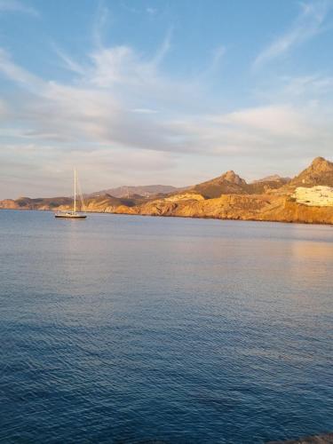 a sailboat in the middle of a large body of water at Philia villas in Agkidia