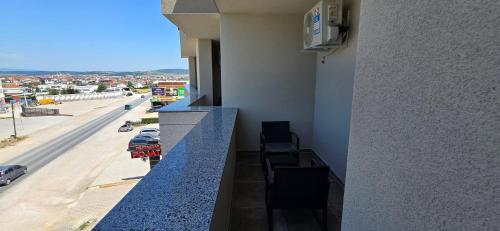 a balcony of a building with a view of a street at Hotel Pojata in Gjilan