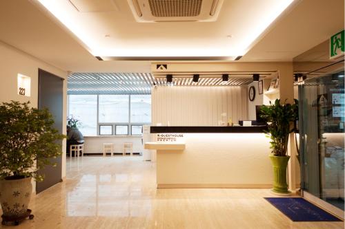 a lobby of a store with a large window at K-Guesthouse Dongdaemun Premium in Seoul