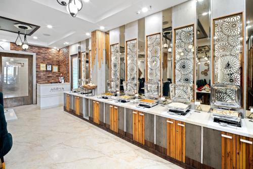 a store with a counter with a lot of vases at PRIME LAND in Varanasi