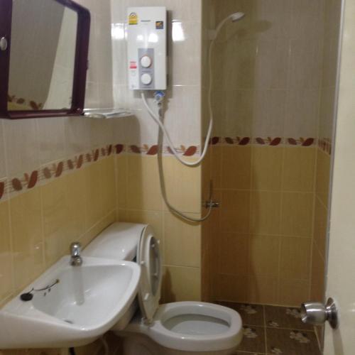 a bathroom with a toilet and a sink at Smart Residence@Muengthongthani in Nonthaburi