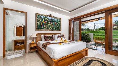 Postel nebo postele na pokoji v ubytování Putih DCarik Ubud